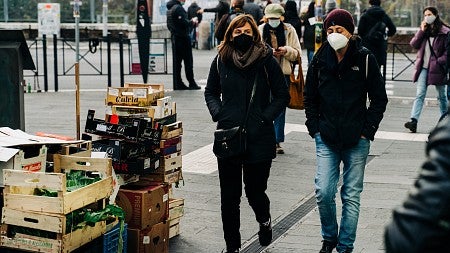 wearing masks walking