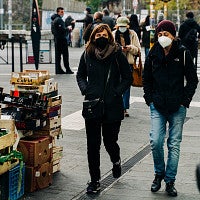 wearing masks walking